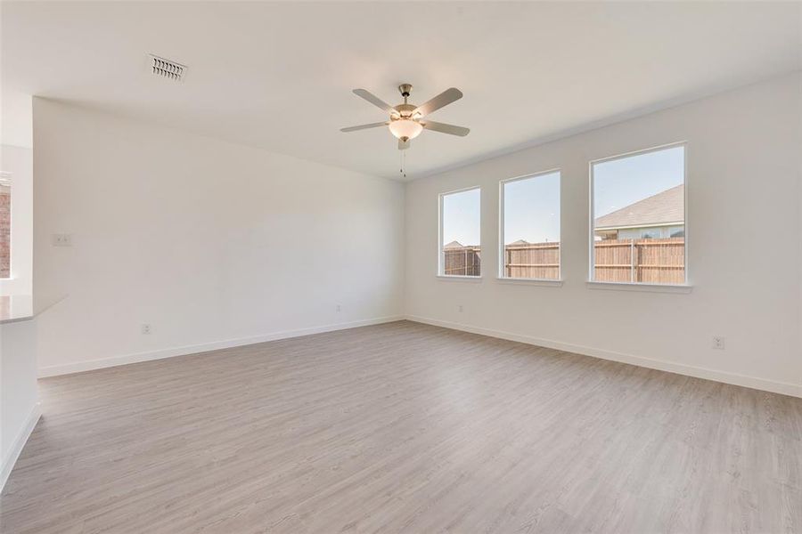 Spare room featuring light hardwood / wood-style flooring and ceiling fan