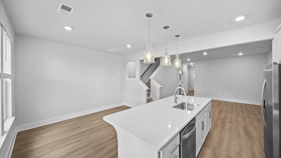 Exclusive kitchen design with large island and pendant lights throughout at Saluda Crossing in Piedmont, SC