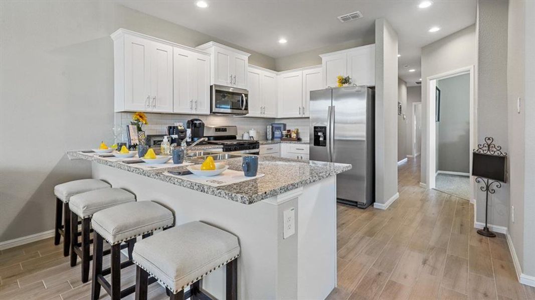 Kitchen - All Home and community information, including pricing, included features, terms, availability and amenities, are subject to change at any time without notice or obligation. All Drawings, pictures, photographs, video, square footages, floor plans, elevations, features, colors and sizes are approximate for illustration purposes only and will vary from the homes as built.