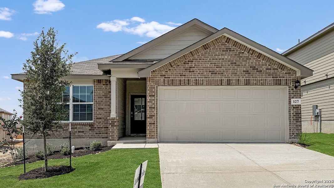 Front exterior of a new home in Redbird Ranch, San Antonio, TX, highlighting curb appeal (Image 12). Front exterior of a new home in Redbird Ranch, San Antonio, TX, highlighting curb appeal (Image 12).