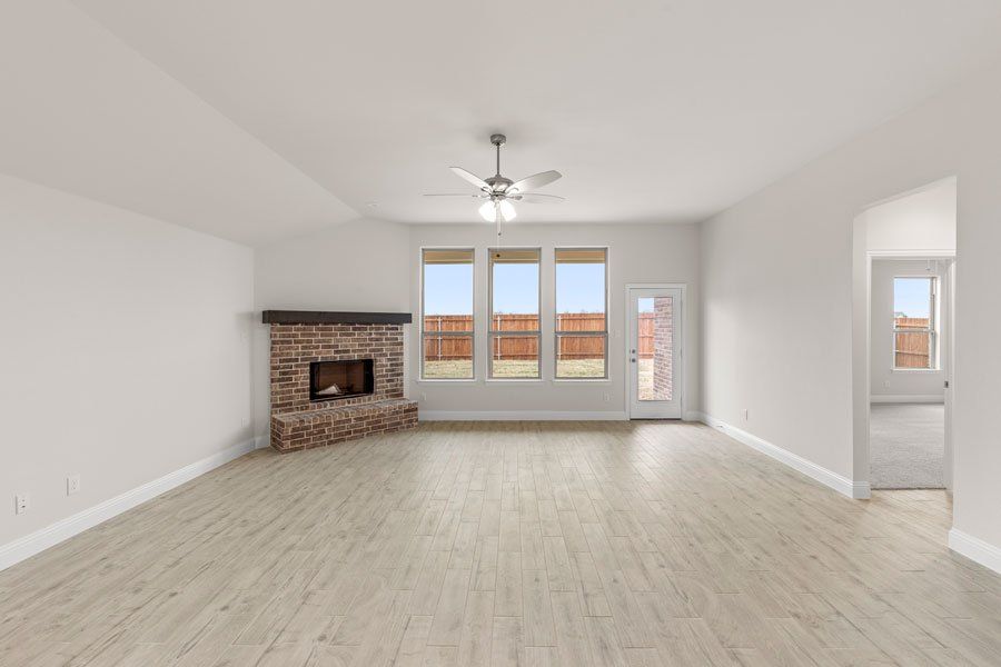 Representative exterior photo of a completed home built from the Kingston by Impression Homes in Timberbrook, Justin, TX (Image 12).