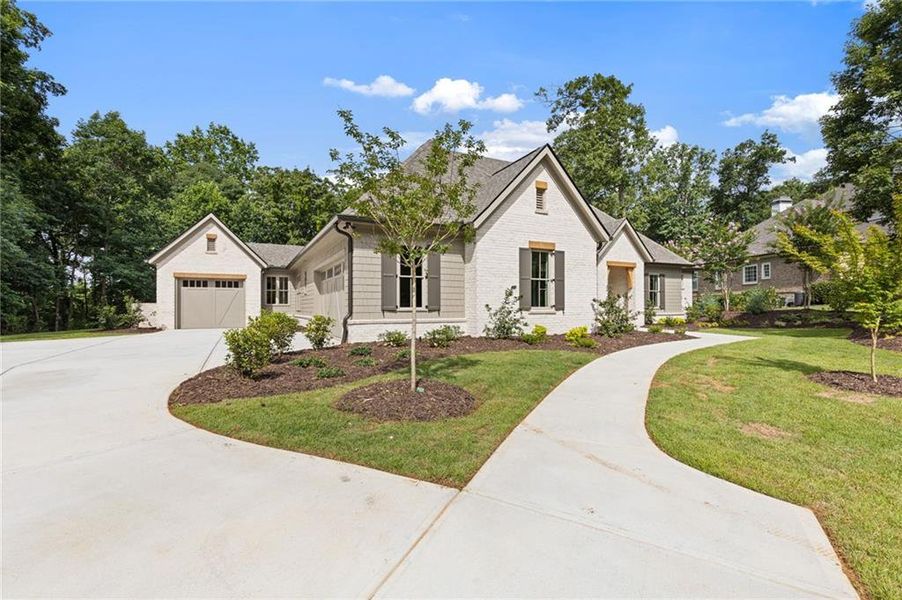 Front exterior of a new home in , Flowery Branch, GA, highlighting curb appeal (Image 29).