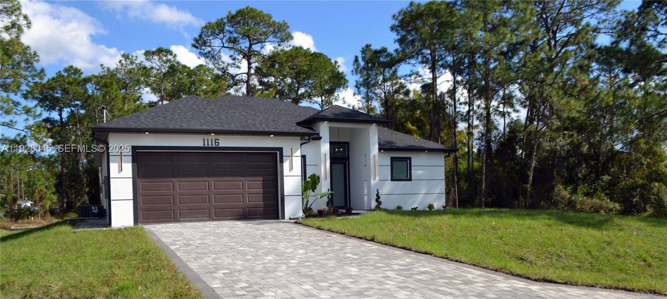 Front exterior of a new home in , Lehigh Acres, FL, highlighting curb appeal (Image 2).