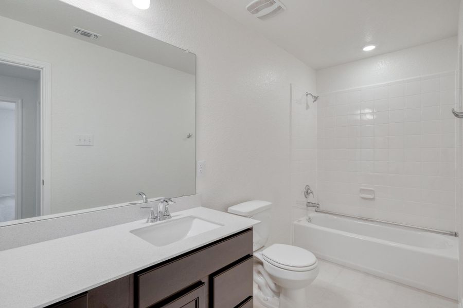 Furnished interior view inside a new home in Mustang Valley, Manor (Image 9). Furnished interior view inside a new home in Mustang Valley, Manor (Image 9).