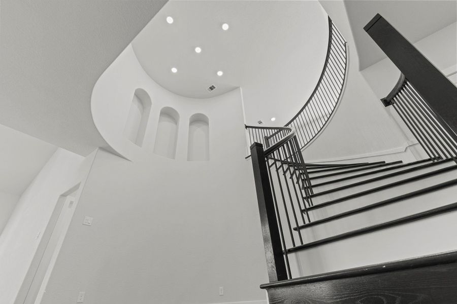 A breathtaking upward view of the staircase showcases its intricate craftsmanship and sculptural beauty — a true design statement that perfectly blends sophistication with CastleRock’s attention to architectural detail. A breathtaking upward view of the staircase showcases its intricate craftsmanship and sculptural beauty — a true design statement that perfectly blends sophistication with CastleRock’s attention to architectural detail.