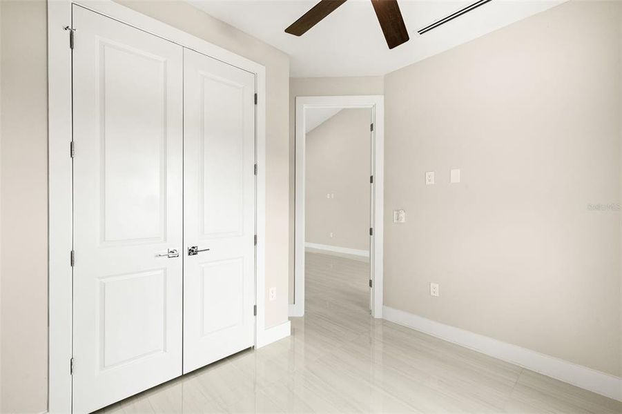 Bedroom 2 closet with built in shelving. Bedroom 2 closet with built in shelving.