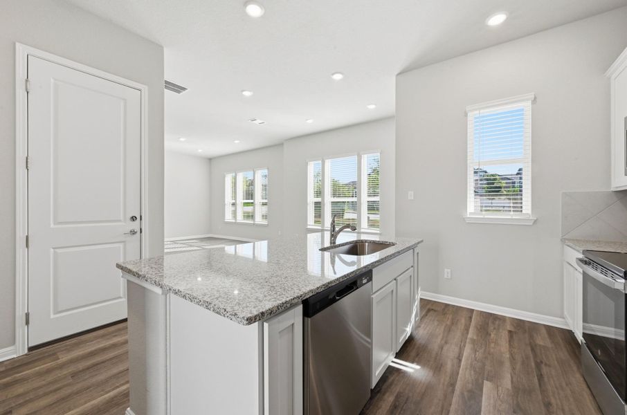 Kitchen island with granite countertop and undermount sink Kitchen island with granite countertop and undermount sink