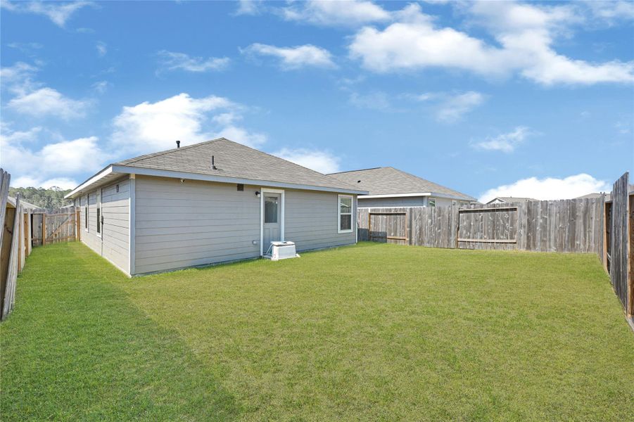 Exterior details and patio area of a home in Townsend Reserve: Cottage Collection, Splendora (Image 3). Exterior details and patio area of a home in Townsend Reserve: Cottage Collection, Splendora (Image 3).