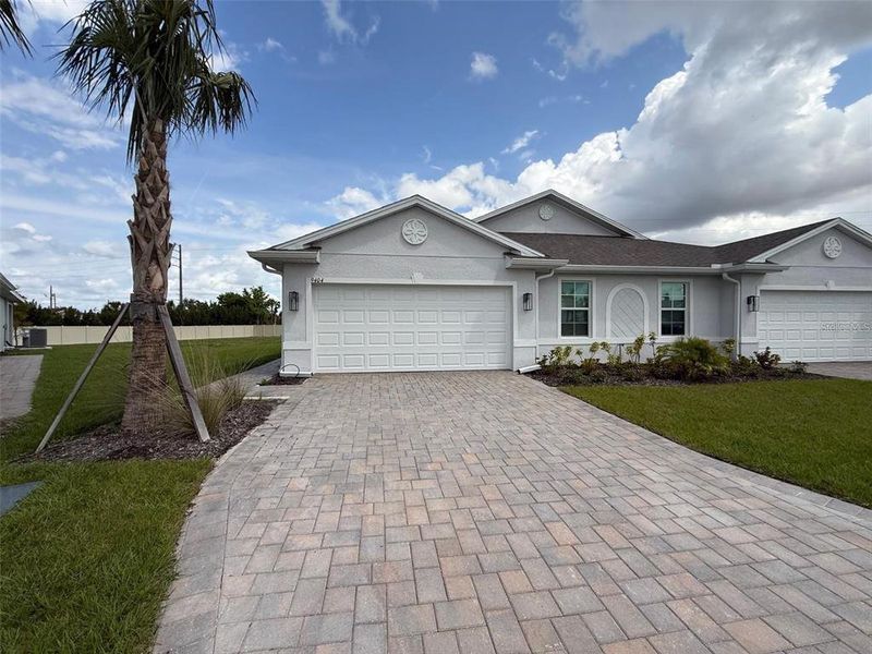 Front exterior of a new home in , Punta Gorda, FL, highlighting curb appeal (Image 2). Front exterior of a new home in , Punta Gorda, FL, highlighting curb appeal (Image 2).