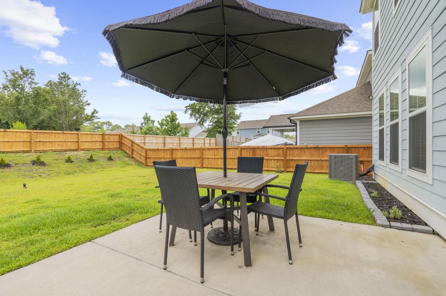 Exterior details and patio area of a home in High Point at Foxbank, Moncks Corner (Image 25).