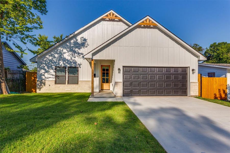 View of front of property with driveway, a garage, and board and batten siding View of front of property with driveway, a garage, and board and batten siding