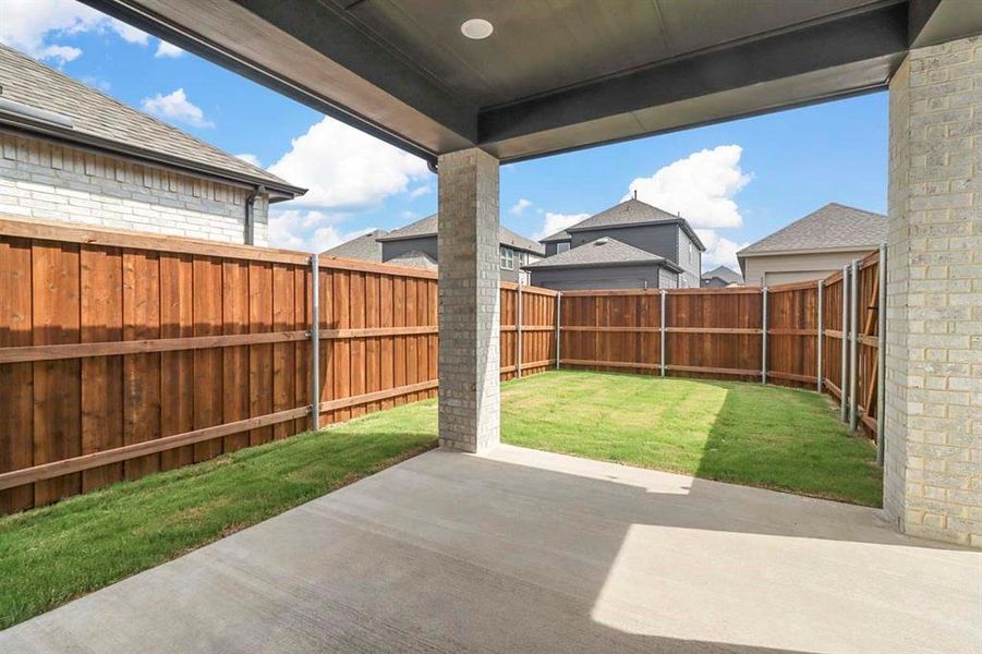 Fenced backyard featuring a patio Fenced backyard featuring a patio