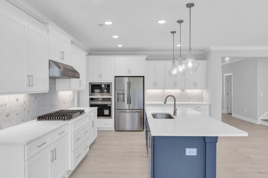 Representative furnished interior of a home built from the The Hampton by RobuckHomes in Windwater, Hampstead (Image 46).