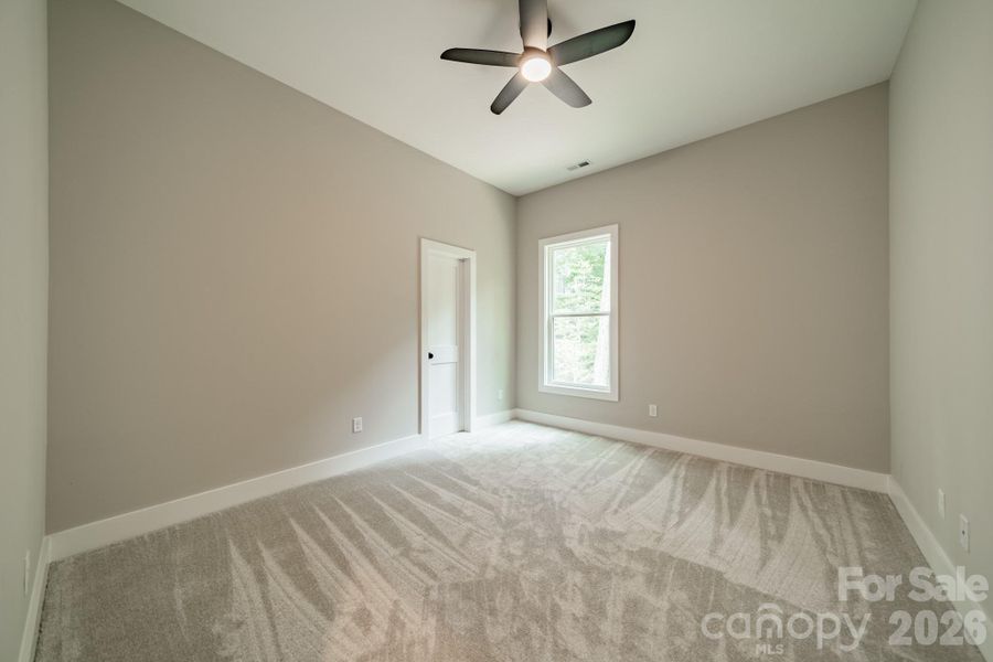 Spacious Bedroom 1 on the Main Level with a Walk-in Closet