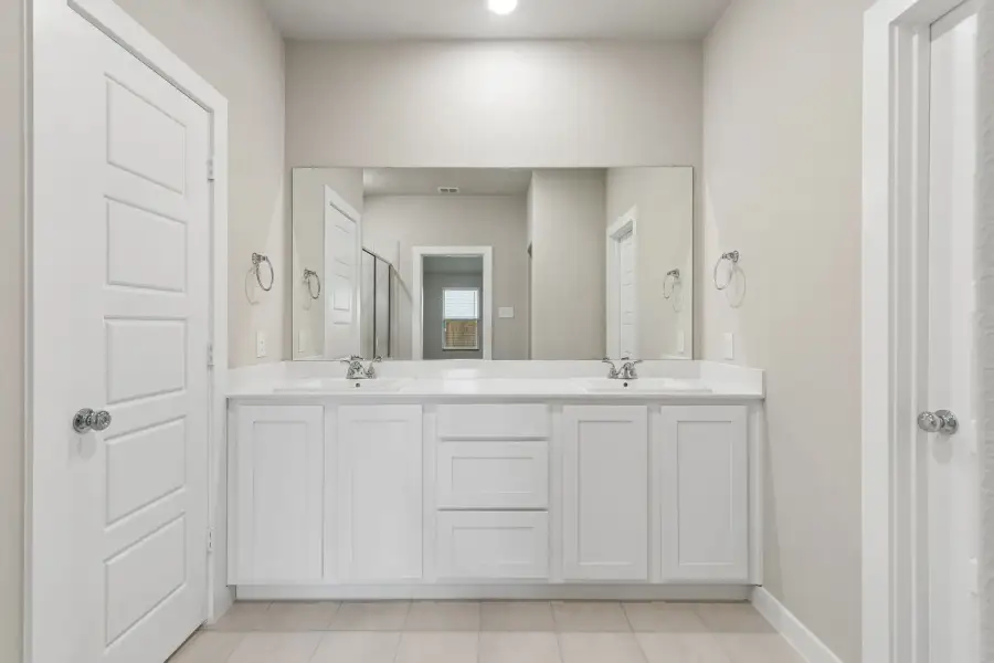 Primary Bathroom in the Emmy II home plan by Trophy Signature Homes - REPRESENTATIVE PHOTO
