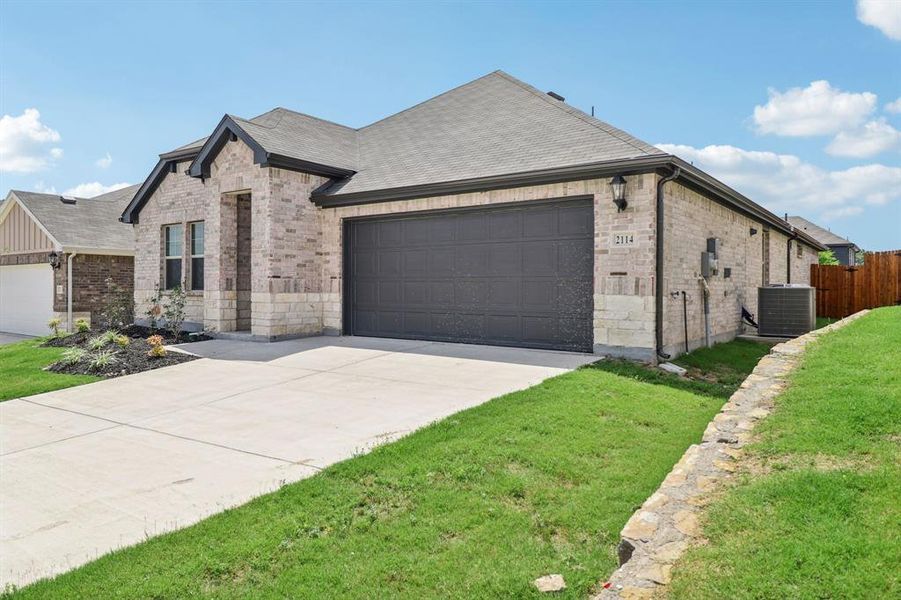 Front exterior of a new home in Westmoor, Sherman, TX, highlighting curb appeal (Image 20).