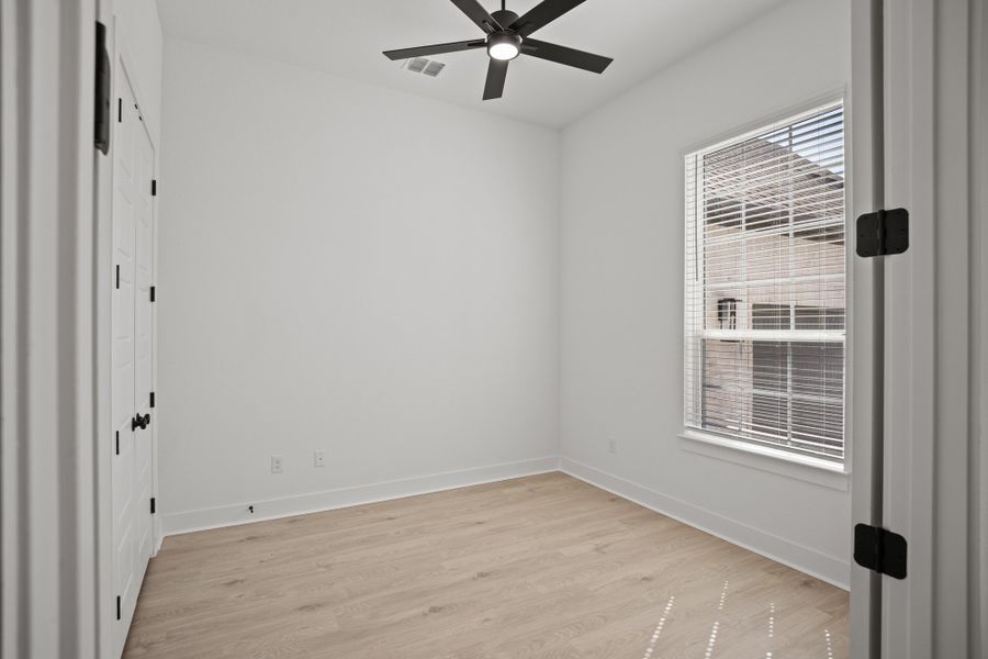 Representative unfurnished interior of a home built from the Farris by Chesmar Homes in The Grove at Blackhawk, Pflugerville (Image 11).