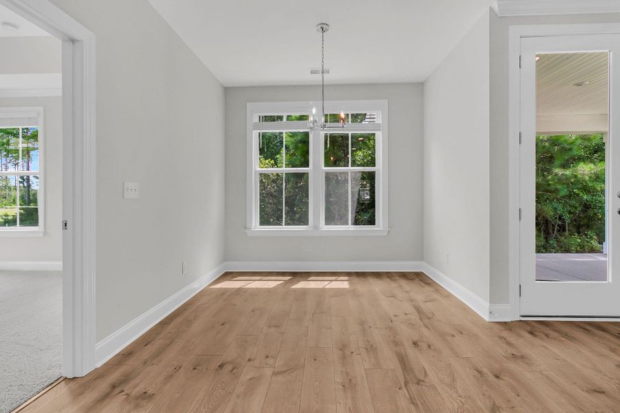 Spacious, unfurnished interior of a new home in Tidewater at Lakes of Cane Bay, Summerville (Image 21).