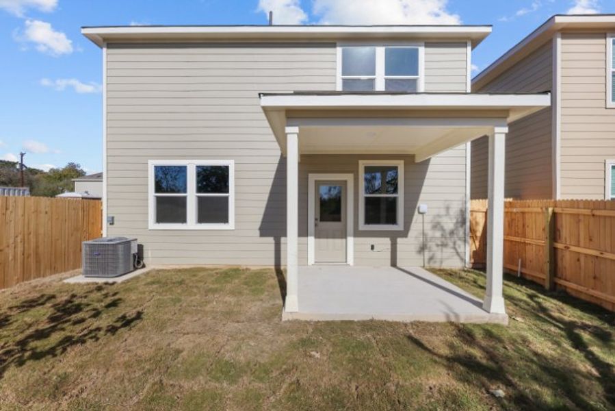 A house with a fence and a yard. A house with a fence and a yard.