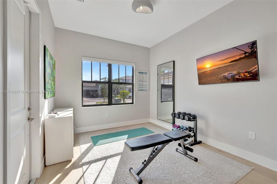 Bright guest area lounge space. Door on the left leads to front of home / driveway