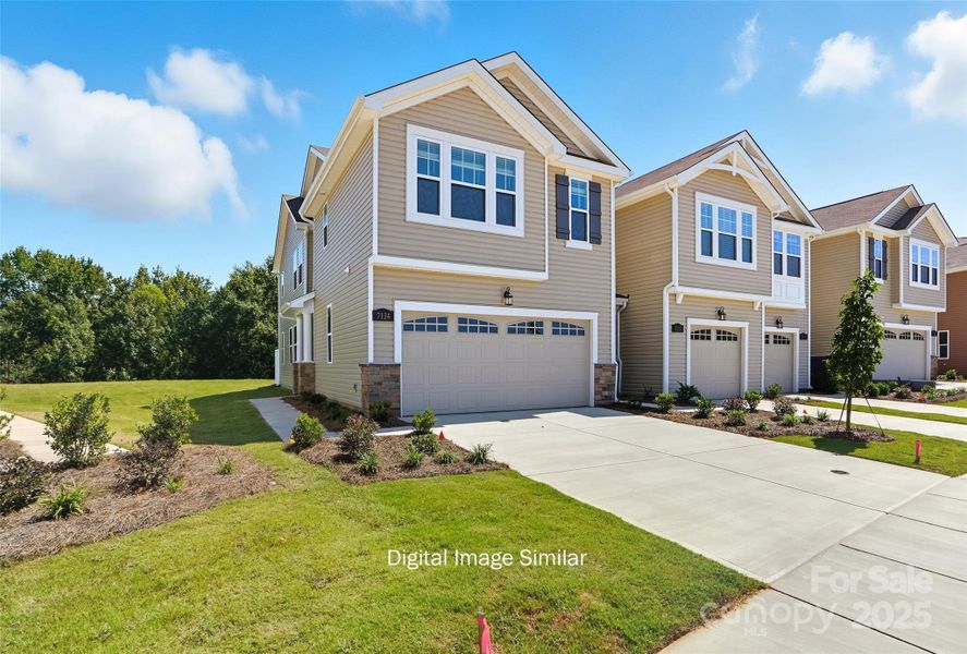 Front exterior of a new home in Bailey Run, Charlotte, NC, highlighting curb appeal (Image 2). Front exterior of a new home in Bailey Run, Charlotte, NC, highlighting curb appeal (Image 2).