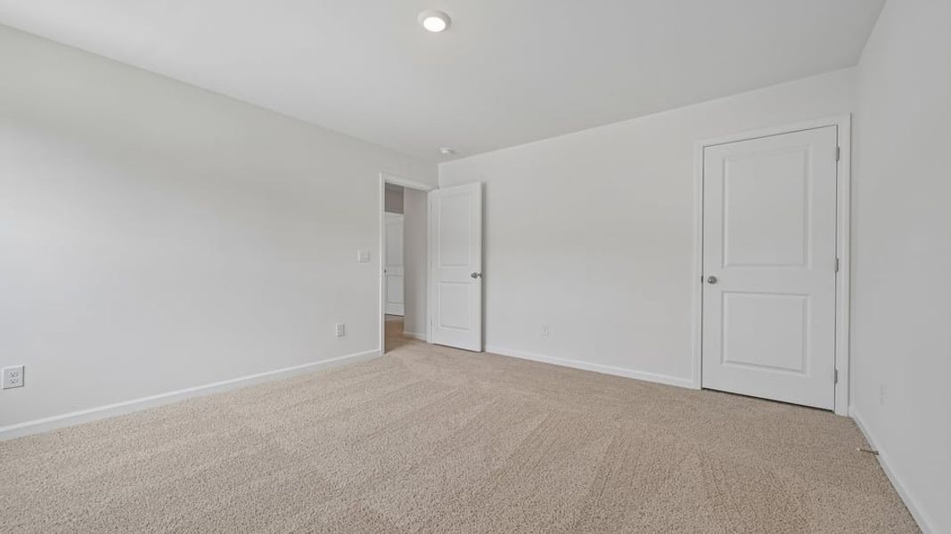 Spacious, unfurnished interior of a new home in Mangum Farms, Stem (Image 24).
