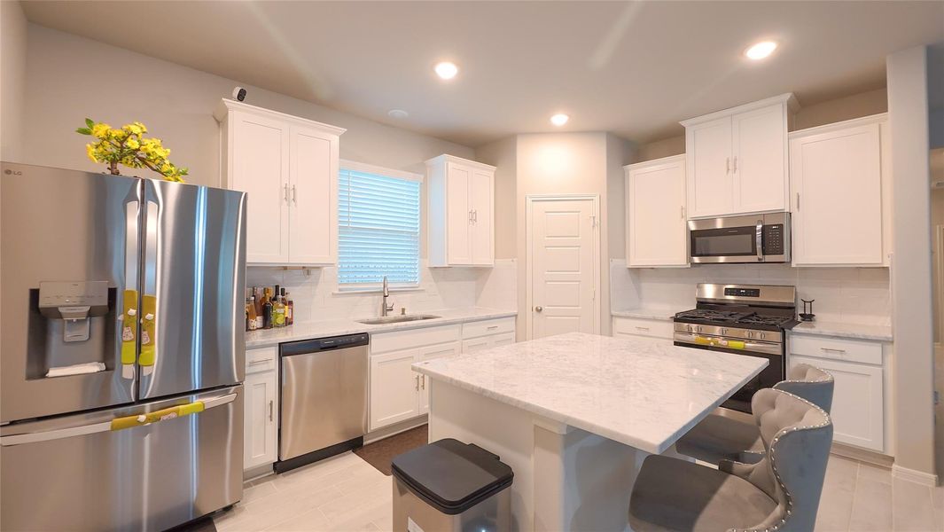 Furnished interior view inside a new home in Sunterra, Katy (Image 6).