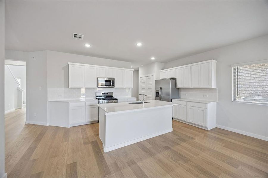 Kitchen in the Oak II home plan by Trophy Signature Homes – REPRESENTATIVE PHOTO
