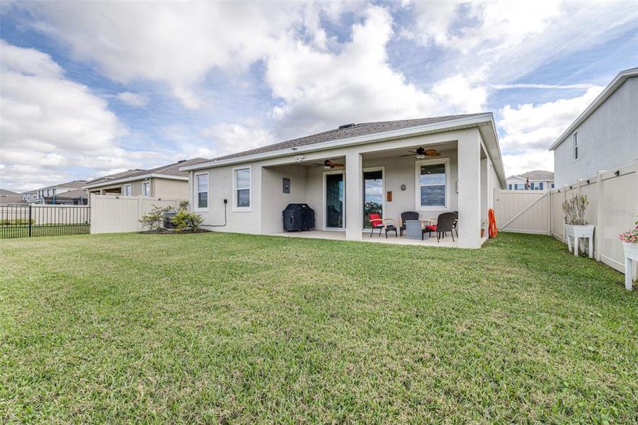 Exterior details and patio area of a home in Farm at Varrea, Plant City (Image 25).