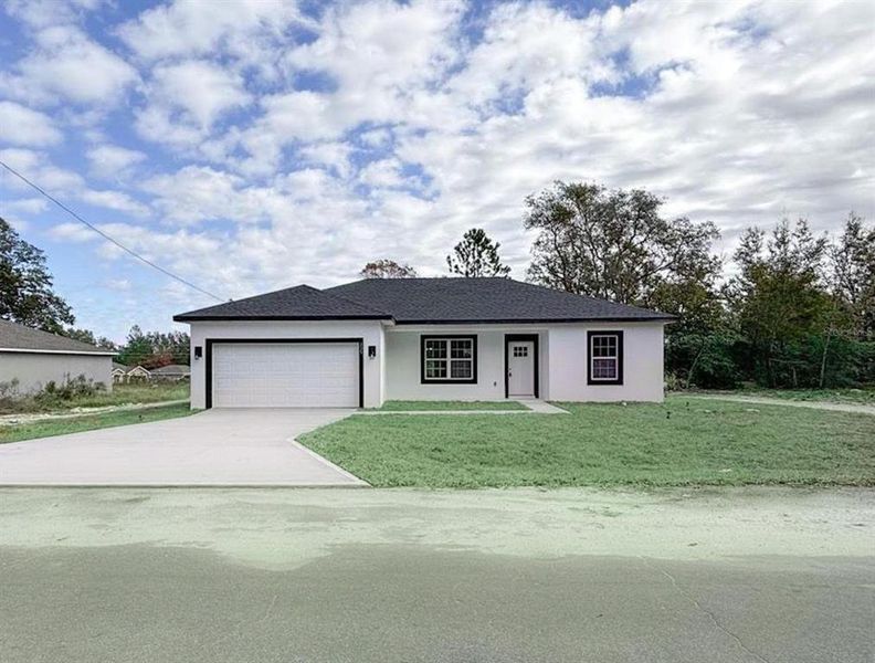 Front exterior of a new home in , Ocklawaha, FL, highlighting curb appeal (Image 20).