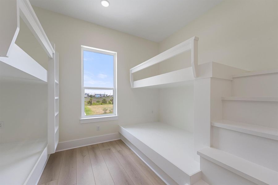 Custom built-in bunks make the most of this cozy guest room—ideal for kids, visitors, or short-term rental potential. Custom built-in bunks make the most of this cozy guest room—ideal for kids, visitors, or short-term rental potential.