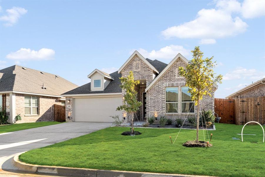 Front exterior of a new home in Godley Ranch Classic, Godley, TX, highlighting curb appeal (Image 2).