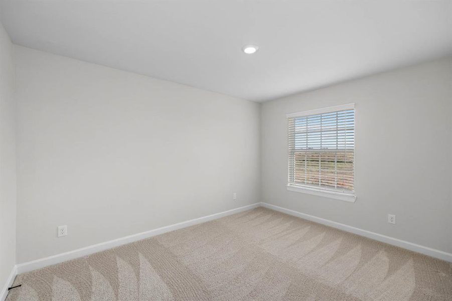 One of the three large upstairs bedrooms.