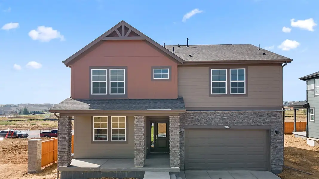Front exterior of a new home in The Legacy Collection at Talon Pointe, Thornton, CO, highlighting curb appeal (Image 2).