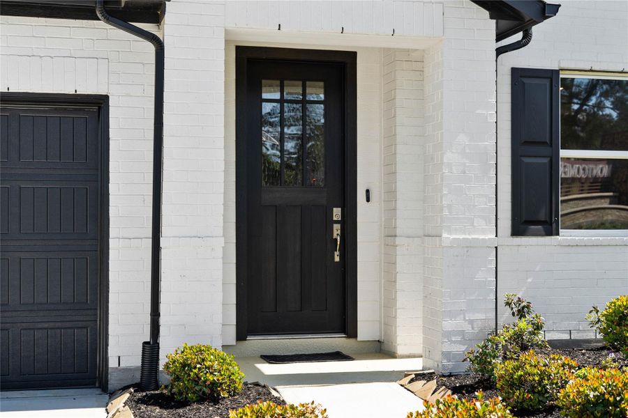 This home is modern elegance with a timeless white brick and siding exterior and high quality entry door. This home is modern elegance with a timeless white brick and siding exterior and high quality entry door.