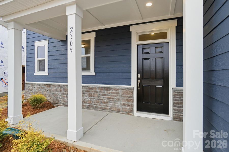 Exterior details and patio area of a home in Wellington Pointe Executive, Monroe (Image 26).