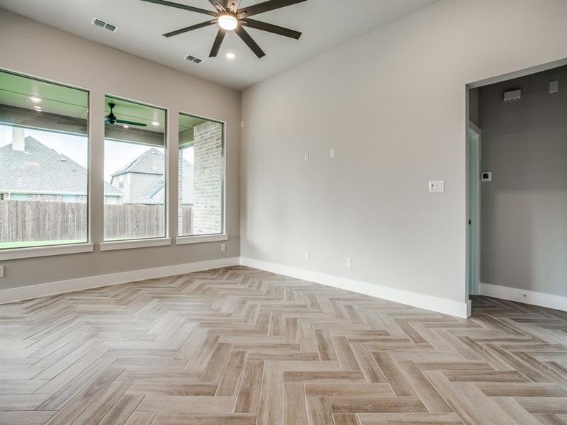 Empty room featuring recessed lighting, visible vents, baseboards, and a ceiling fan