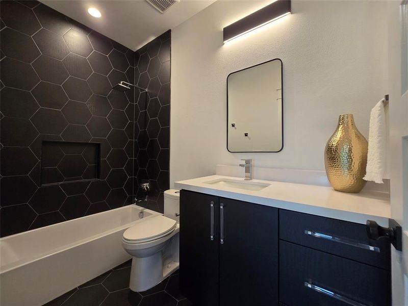 Secondary bathroom upstairs with a tub.