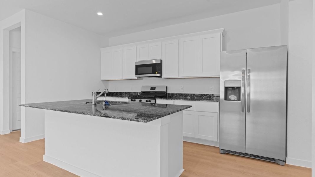 Representative furnished interior of a home built from the Caden by D.R. Horton in Caldwell Crossing, Iowa Colony (Image 5).