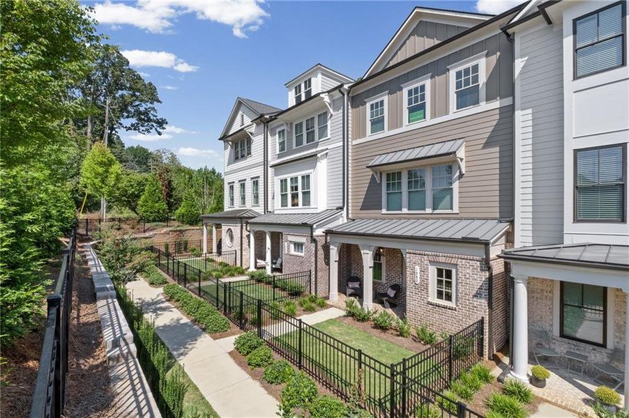 Front exterior of a new home in Devin's Shire, Kennesaw, GA, highlighting curb appeal (Image 2). Front exterior of a new home in Devin's Shire, Kennesaw, GA, highlighting curb appeal (Image 2).