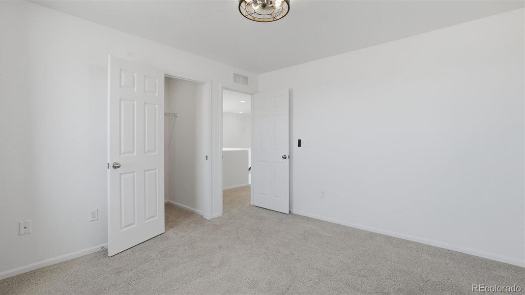 Upper Level Bedroom #2 with walk in closet.