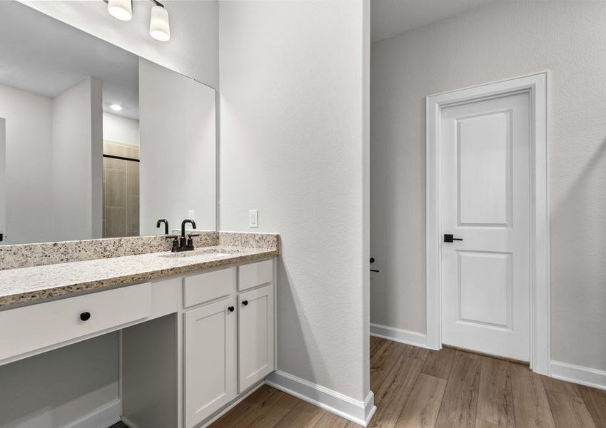 The master bath has a private commode and tons of drawer space.