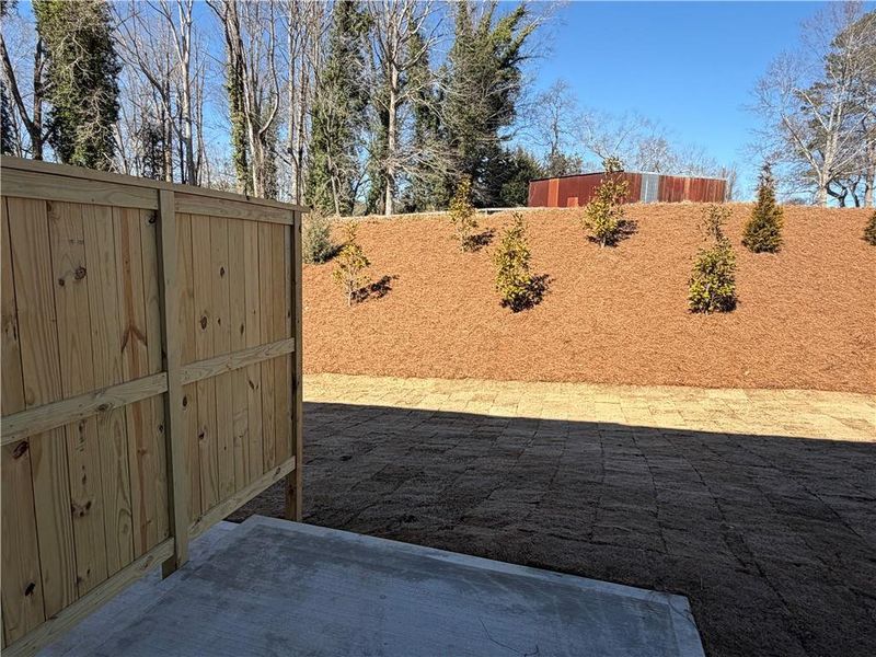 Exterior details and patio area of a home in Villas at Dawsonville Townhomes, Dawsonville (Image 2).