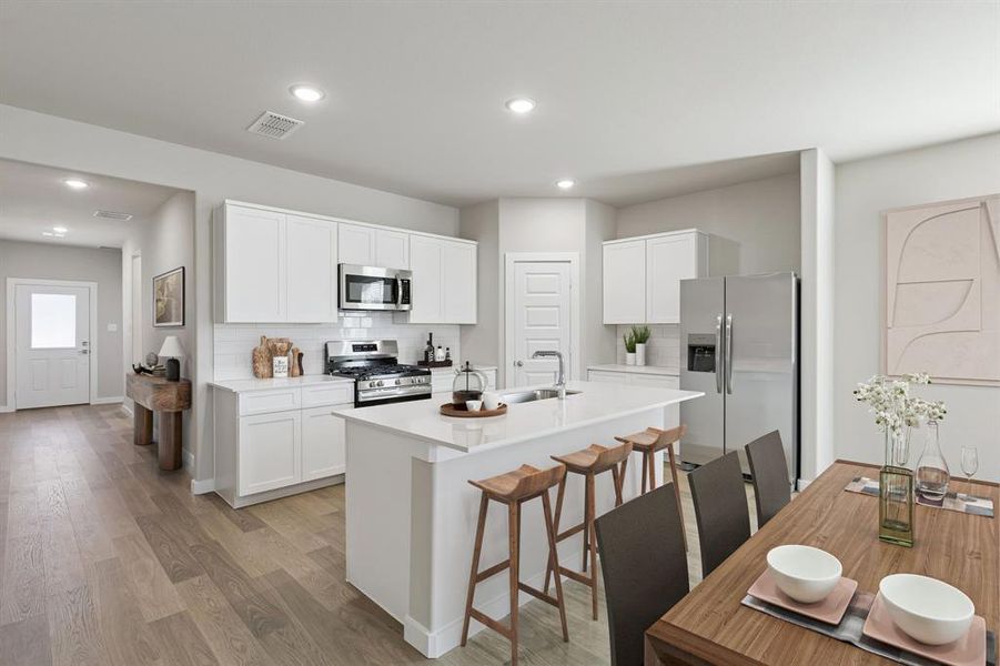 Kitchen in the Holden home plan by Trophy Signature Homes – REPRESENTATIVE PHOTO Kitchen in the Holden home plan by Trophy Signature Homes – REPRESENTATIVE PHOTO