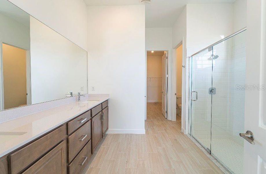 Furnished interior view inside a new home in Tesoro Club, Port St. Lucie (Image 8).