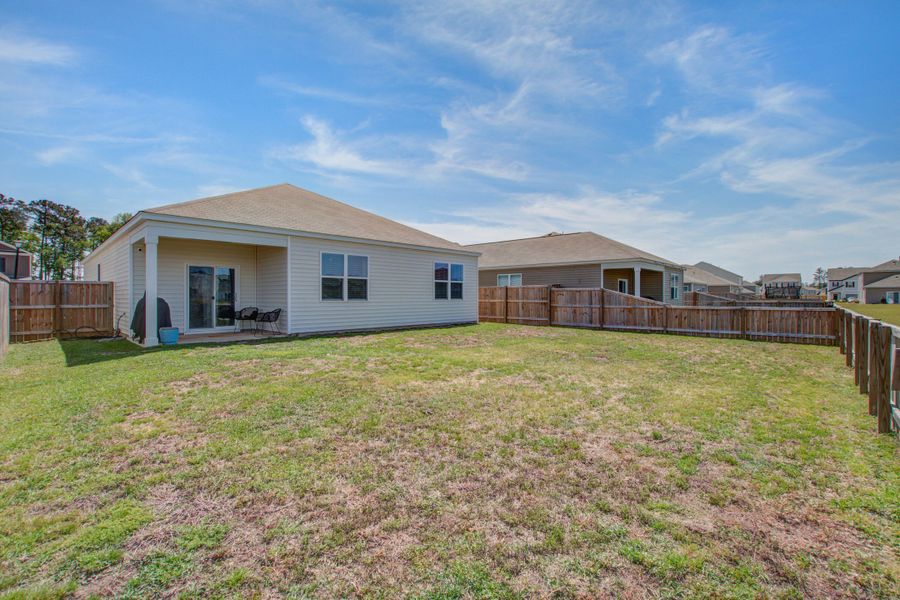 Exterior details and patio area of a home in Pine Hills at Cane Bay, Summerville (Image 27).