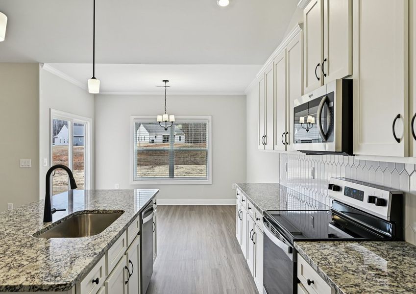 This kitchen includes beautiful cabinetry This kitchen includes beautiful cabinetry