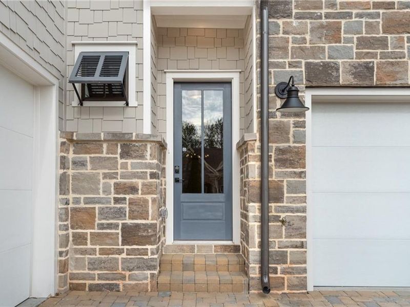 Exterior details and patio area of a home in The Village at Towne Lake, Woodstock (Image 2).