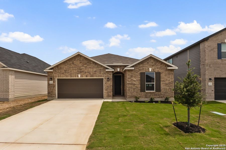 Front exterior of a new home in Preserve at Culebra - Classic Collection, San Antonio, TX, highlighting curb appeal (Image 1).