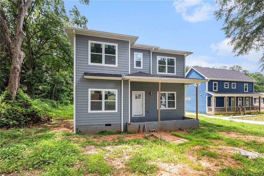 Front exterior of a new home in , Lithonia, GA, highlighting curb appeal (Image 11).